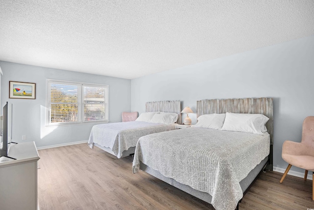 600-B 43rd Ave S, North Myrtle Beach, SC 29582 - bedroom featuring wood finished floors and a textured ceiling