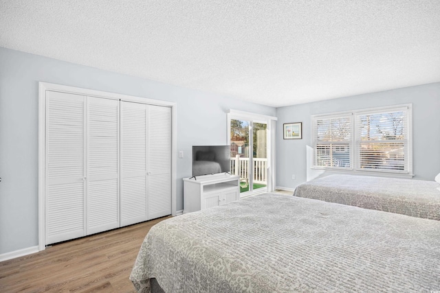 600-B 43rd Ave S, North Myrtle Beach, SC 29582 - bedroom featuring wood finished floors, a textured ceiling, and a closet