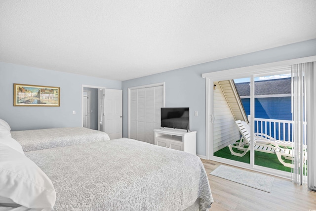 600-B 43rd Ave S, North Myrtle Beach, SC 29582 - bedroom with access to outside, wood finished floors, a textured ceiling, and a closet