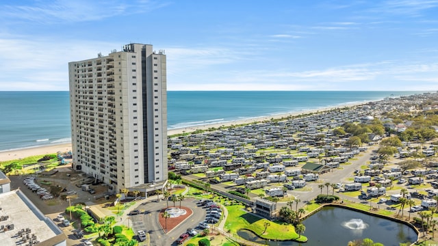 drone / aerial view with a water view and a view of the beach
