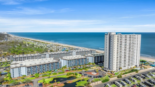 aerial view with a water view and a beach view