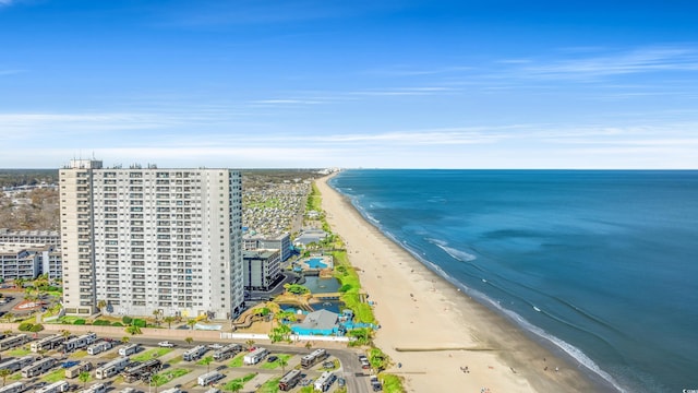 birds eye view of property with a view of the beach and a water view