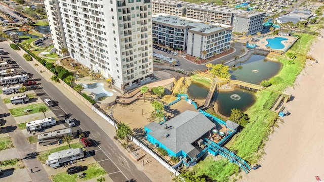 bird's eye view featuring a water view and a city view