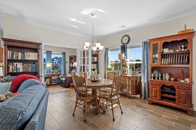 100 Marblehead Dr, Little River, SC 29566 - dining space featuring a chandelier, healthy amount of natural light, wood finish floors, and crown molding