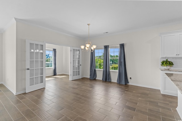 100 Marblehead Dr, Little River, SC 29566 - unfurnished room featuring french doors, ornamental molding, a chandelier, plenty of natural light, and dark wood-type flooring
