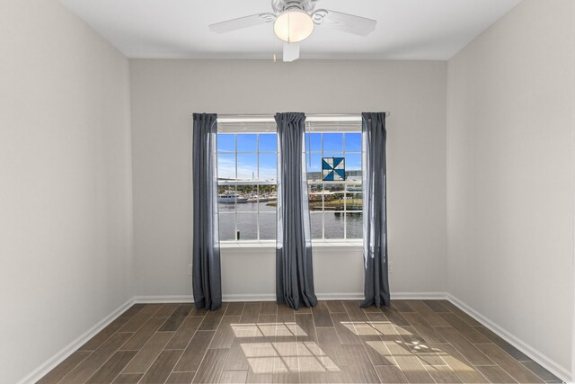 100 Marblehead Dr, Little River, SC 29566 - empty room with wood tiled floors, ceiling fan, and a water view