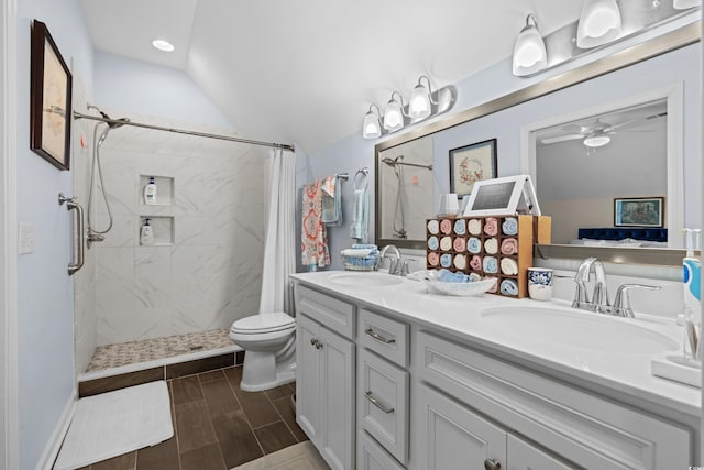 100 Marblehead Dr, Little River, SC 29566 - bathroom with tiled shower, vaulted ceiling, wood finish floors, a ceiling fan, and double vanity