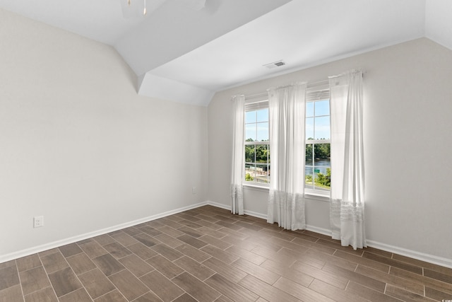 100 Marblehead Dr, Little River, SC 29566 - empty room featuring vaulted ceiling, ceiling fan, and dark wood-type flooring