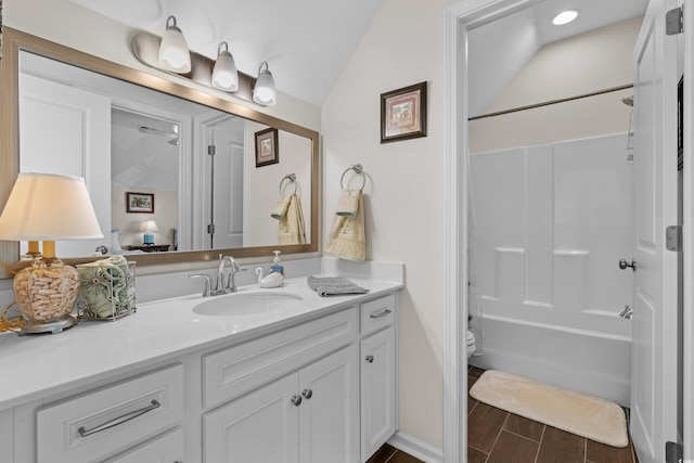 100 Marblehead Dr, Little River, SC 29566 - bathroom with vanity, toilet, vaulted ceiling, and tub / shower combination