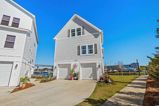 100 Marblehead Dr, Little River, SC 29566 - view of front of house featuring an attached garage, concrete driveway, and board and batten siding