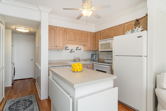 kitchen with light countertops, white appliances, ornamental molding, wood finished floors, and a sink