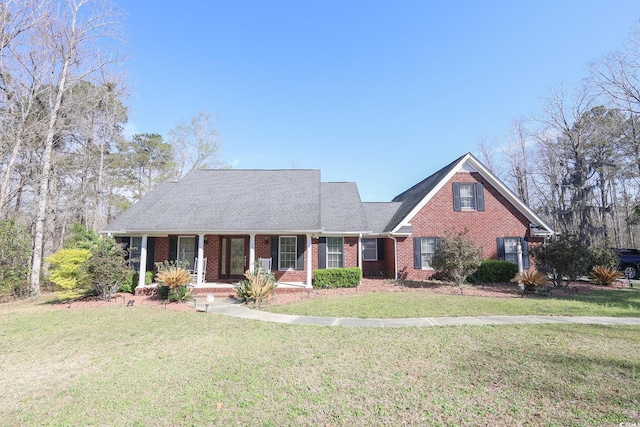 3731 Love Ln, Conway, SC 29527 - traditional-style home with covered porch, a front lawn, and brick siding