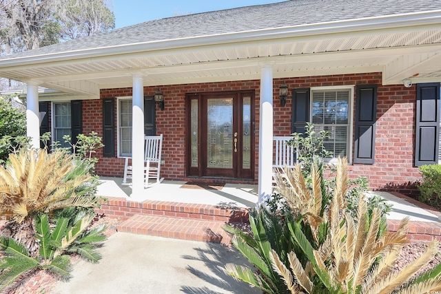 3731 Love Ln, Conway, SC 29527 - doorway to property featuring brick siding, a porch, and roof with shingles
