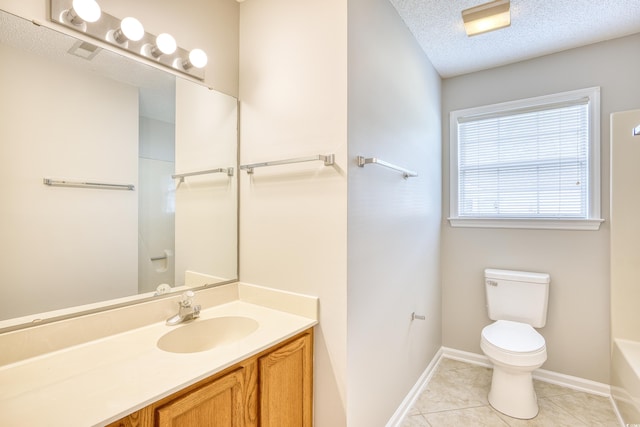 1161 Ganton Way, Myrtle Beach, SC 29588 - full bath with toilet, baseboards, a tub to relax in, a textured ceiling, and tile patterned floors
