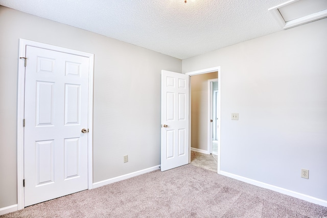 1161 Ganton Way, Myrtle Beach, SC 29588 - unfurnished bedroom featuring carpet floors, attic access, baseboards, and a textured ceiling