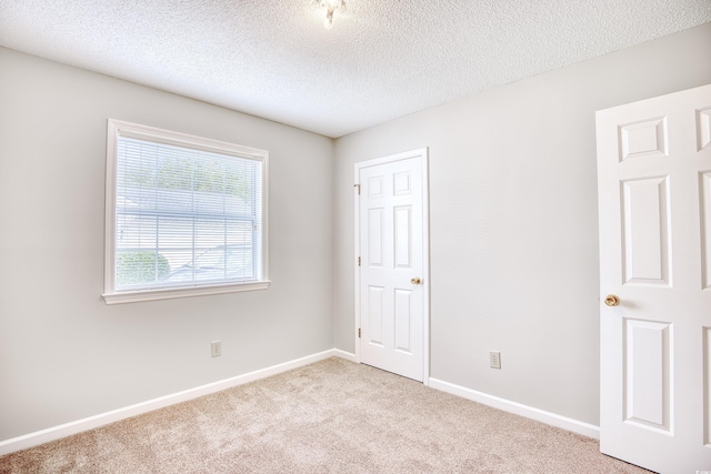 1161 Ganton Way, Myrtle Beach, SC 29588 - unfurnished bedroom featuring carpet floors, a textured ceiling, and baseboards