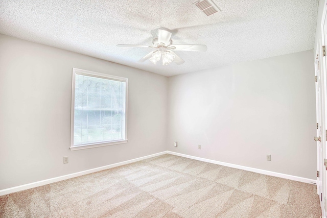 1161 Ganton Way, Myrtle Beach, SC 29588 - unfurnished room with light carpet, a ceiling fan, a textured ceiling, and baseboards