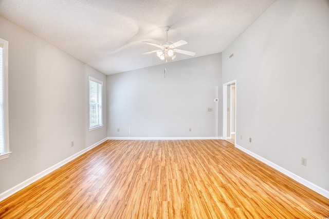 1161 Ganton Way, Myrtle Beach, SC 29588 - spare room featuring light wood-type flooring, a textured ceiling, ceiling fan, baseboards, and lofted ceiling