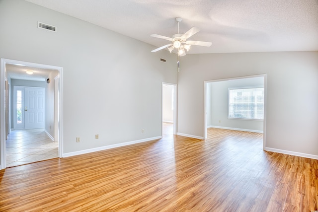 1161 Ganton Way, Myrtle Beach, SC 29588 - spare room with healthy amount of natural light, a ceiling fan, light wood-type flooring, a textured ceiling, and vaulted ceiling