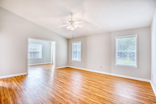 1161 Ganton Way, Myrtle Beach, SC 29588 - empty room with ceiling fan, light wood-style flooring, a textured ceiling, baseboards, and vaulted ceiling
