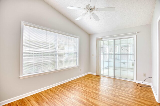 1161 Ganton Way, Myrtle Beach, SC 29588 - unfurnished room with vaulted ceiling, a textured ceiling, light wood-style floors, ceiling fan, and baseboards