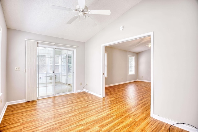 1161 Ganton Way, Myrtle Beach, SC 29588 - unfurnished room with vaulted ceiling, light wood finished floors, a ceiling fan, a textured ceiling, and baseboards