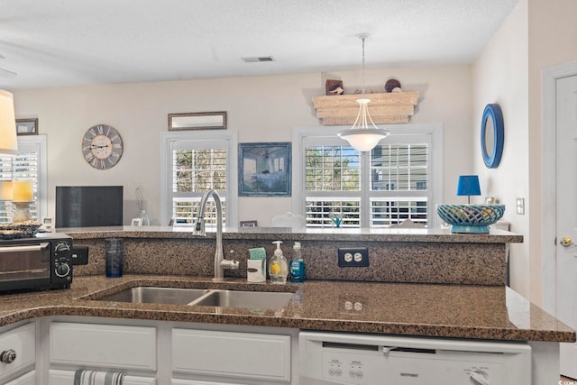 5050 Belleglen Ct Unit 102, Myrtle Beach, SC 29579 - kitchen featuring a sink, dark stone counters, a toaster, dishwasher, and white cabinets