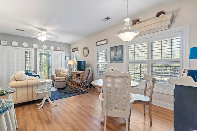 5050 Belleglen Ct Unit 102, Myrtle Beach, SC 29579 - dining room featuring visible vents, wood finished floors, baseboards, and ceiling fan