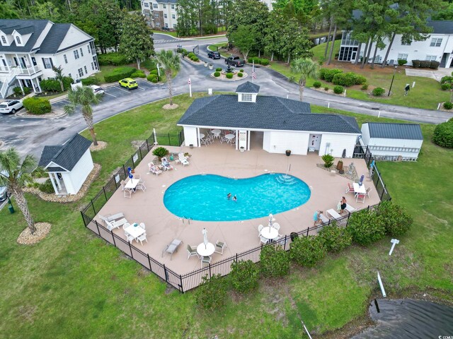 5050 Belleglen Ct Unit 102, Myrtle Beach, SC 29579 - community pool with a lawn, a patio area, and fence