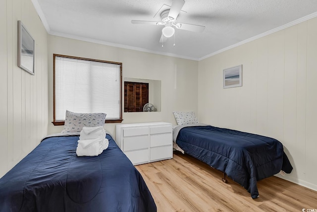 9620 Shore Dr Unit 105, Myrtle Beach, SC 29572 - bedroom featuring light wood finished floors, ornamental molding, and ceiling fan