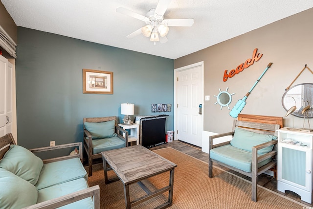 interior space with a ceiling fan and wood finished floors