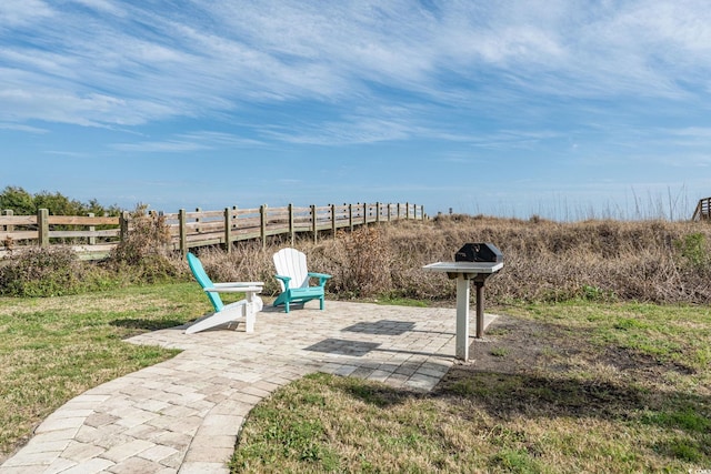 view of yard featuring fence and a patio area