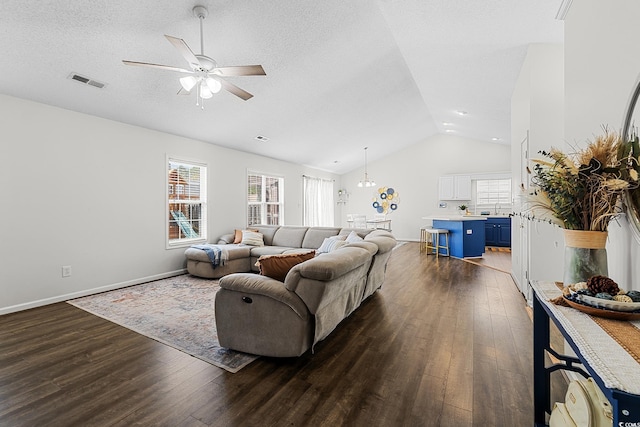 445 Saint Charles Cir, Myrtle Beach, SC 29588 - living area with lofted ceiling, dark wood-type flooring, a ceiling fan, baseboards, and a textured ceiling
