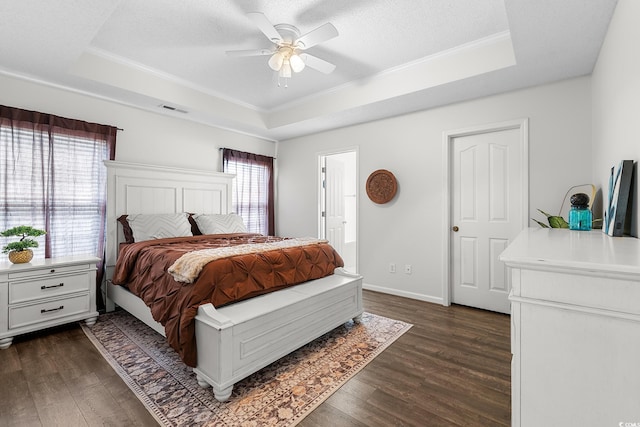 445 Saint Charles Cir, Myrtle Beach, SC 29588 - bedroom featuring a raised ceiling, ornamental molding, dark wood-type flooring, and a textured ceiling