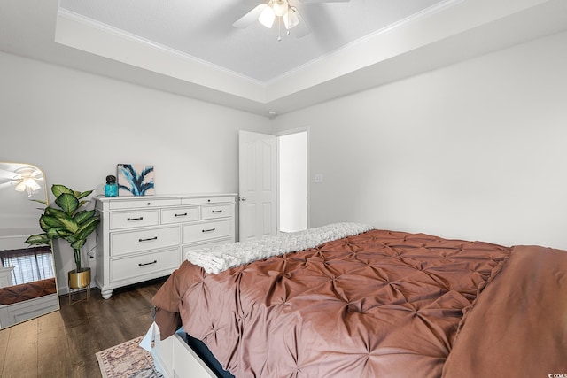 445 Saint Charles Cir, Myrtle Beach, SC 29588 - bedroom with dark wood finished floors, crown molding, a tray ceiling, and a ceiling fan