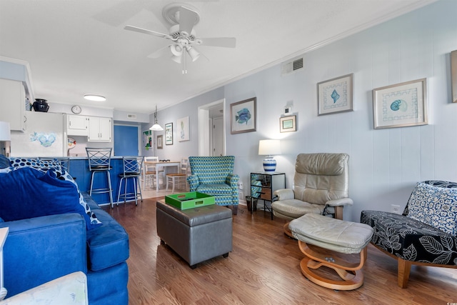 5601 N Ocean Blvd Unit 214B, Myrtle Beach, SC 29577 - living room featuring ornamental molding, dark wood-style flooring, and a ceiling fan