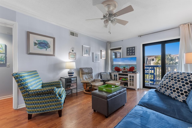 5601 N Ocean Blvd Unit 214B, Myrtle Beach, SC 29577 - living room with wood finished floors, a ceiling fan, baseboards, and ornamental molding