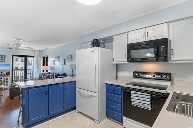5601 N Ocean Blvd Unit 214B, Myrtle Beach, SC 29577 - kitchen with black microwave, range with electric stovetop, freestanding refrigerator, a peninsula, and open floor plan