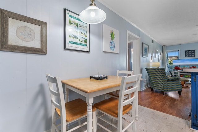 5601 N Ocean Blvd Unit 214B, Myrtle Beach, SC 29577 - dining room with tile patterned floors and ornamental molding