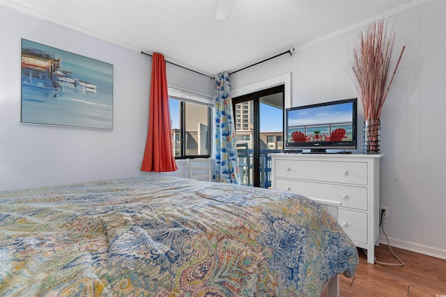 5601 N Ocean Blvd Unit 214B, Myrtle Beach, SC 29577 - bedroom with wood finished floors, crown molding, and baseboards