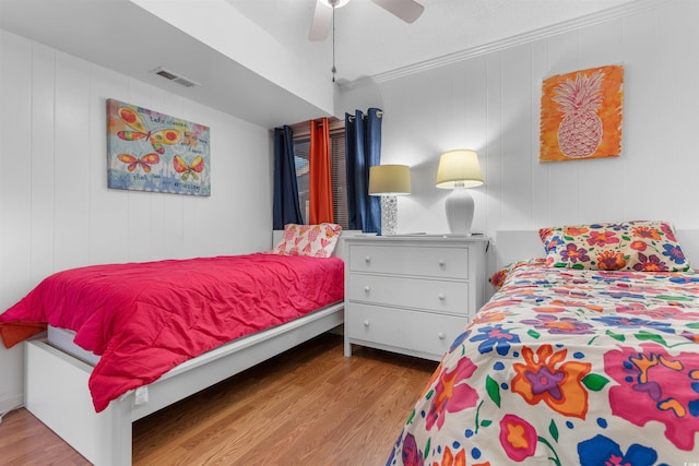 5601 N Ocean Blvd Unit 214B, Myrtle Beach, SC 29577 - bedroom with wood finished floors, a ceiling fan, and crown molding