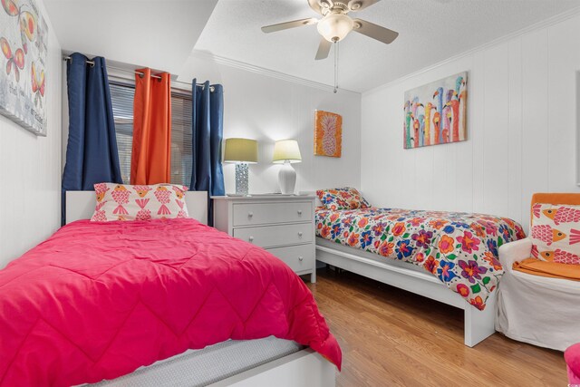 5601 N Ocean Blvd Unit 214B, Myrtle Beach, SC 29577 - bedroom with wood finished floors, ornamental molding, and a ceiling fan