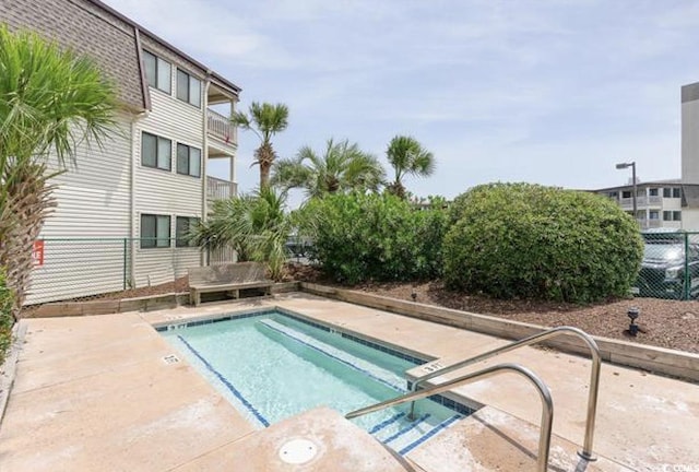 5601 N Ocean Blvd Unit 214B, Myrtle Beach, SC 29577 - view of swimming pool featuring a swimming pool and fence