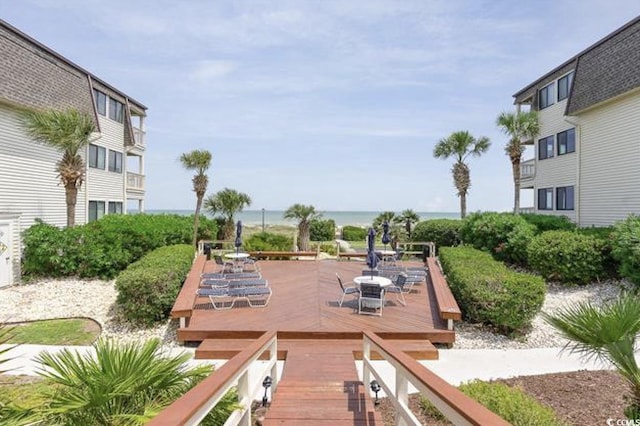 5601 N Ocean Blvd Unit 214B, Myrtle Beach, SC 29577 - view of community featuring outdoor dining area and a deck with water view