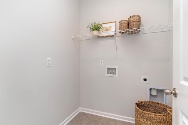 laundry room with washer hookup, electric dryer hookup, baseboards, and light tile patterned floors