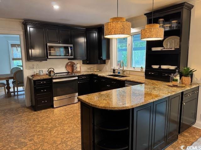 kitchen with open shelves, appliances with stainless steel finishes, a sink, dark cabinets, and a peninsula
