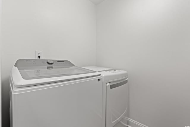 207 Fox Ln, Murrells Inlet, SC 29576 - washroom featuring baseboards, washing machine and clothes dryer, and laundry area