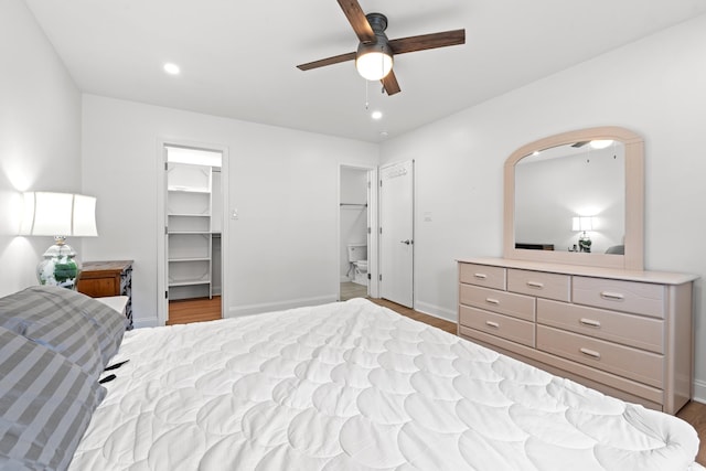 207 Fox Ln, Murrells Inlet, SC 29576 - bedroom with wood finished floors, a spacious closet, baseboards, ceiling fan, and recessed lighting