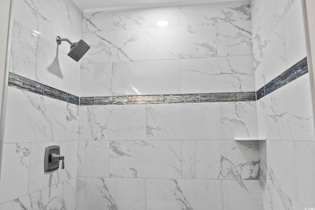 bathroom featuring tiled shower