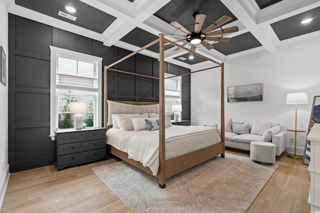 849 Crystal Water Way, Myrtle Beach, SC 29579 - bedroom featuring coffered ceiling, beamed ceiling, crown molding, light wood-style flooring, and a ceiling fan